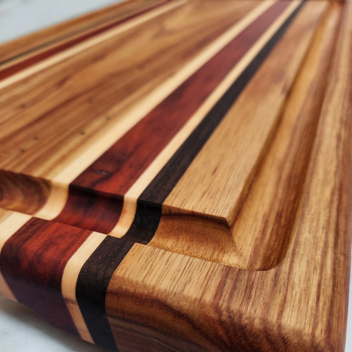 Canary Wood, Padauk, Maple & Walnut Cutting Board