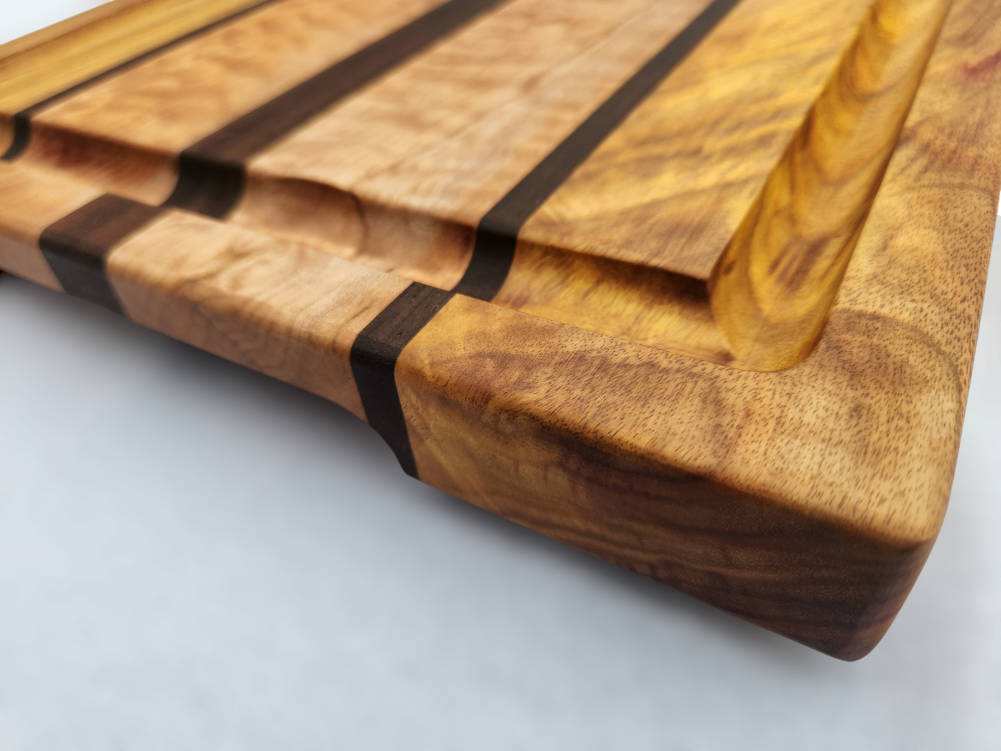 Canary Wood, Figured Maple & Peruvian Walnut Cutting Board